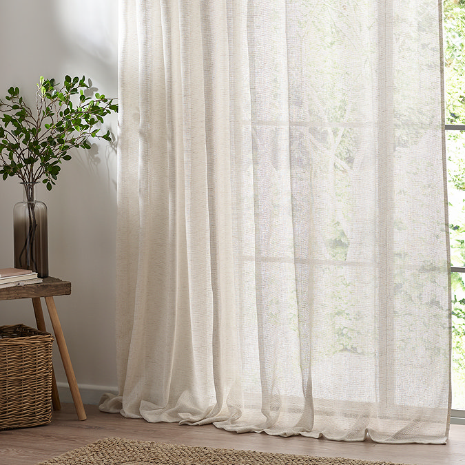 Nimbus Tie Top Sheer Curtain Panel in natural in front of a window close up image