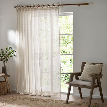 Nimbus Tie Top Sheer Curtain Panel in natural in front of a window close up image
