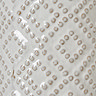 close up image of beaded detail on white ceramic vase