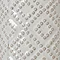 close up image of beaded detail on white ceramic vase