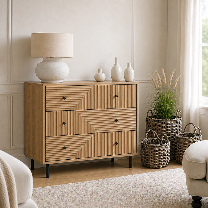 lifestyle image of oak geometric three drawer chest with black handles