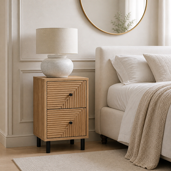 lifestyle image of oak geometric bedside table with small black handles