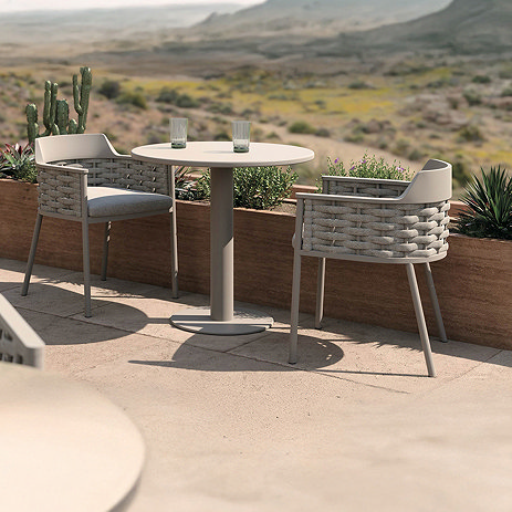 image of natural woven bistro set on sunny balcony