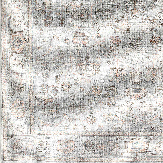 close up zoomed in image of traditional floral rug in tan and grey colours
