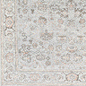 close up zoomed in image of traditional floral rug in tan and grey colours