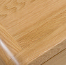 close up on light wood grain of a desk