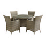 image cut out on white background of rattan round dining table with four high backed chairs tucked under