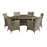 image cut out on white background of rattan dining chairs round matching table with tempered glass top