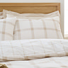 Oxton duvet cover set in natural on bed image 3