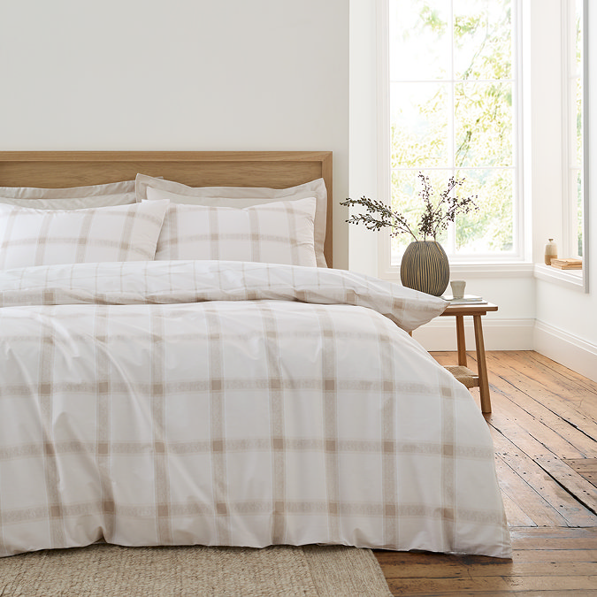 Oxton duvet cover set in natural on bed image 1