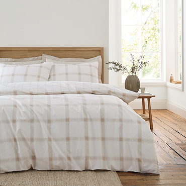 Oxton duvet cover set in natural on bed image 1