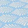 close up image of sky blue and white pattern of outdoor rug