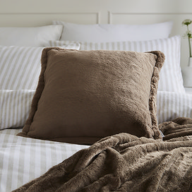 Pascoe Faux Fur Cushion Mocha on a White Duvet Cover With Throw