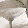 close up image on texture of beige chenille dining chair seat