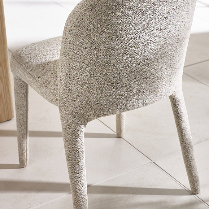 image of back of beige chenille dining chair