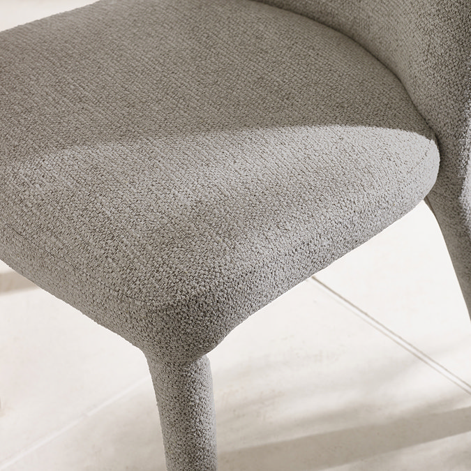 close up image of grey chenille dining chair seat, focus on texture and colour