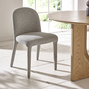 image taken from behind of grey chenille dining chair back with upholstered legs