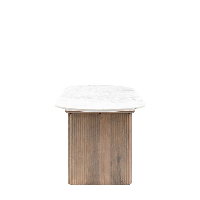 side on image of oval solid mango wood dining table with marble tabletop