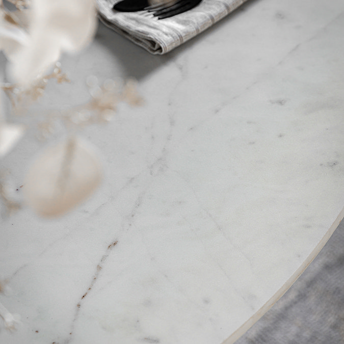 close up image of white marble dining tabletop