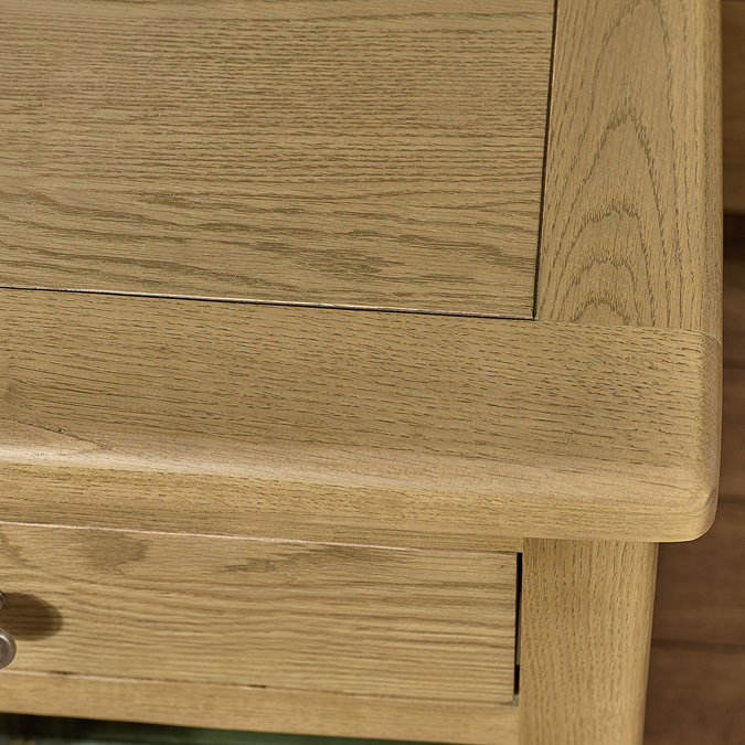 close up image of oak wood top of bedside table