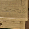 close up image of oak wood top of bedside table