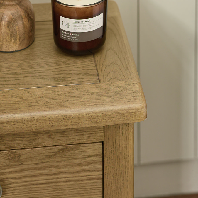 close up image of smooth edges of oak bedside table
