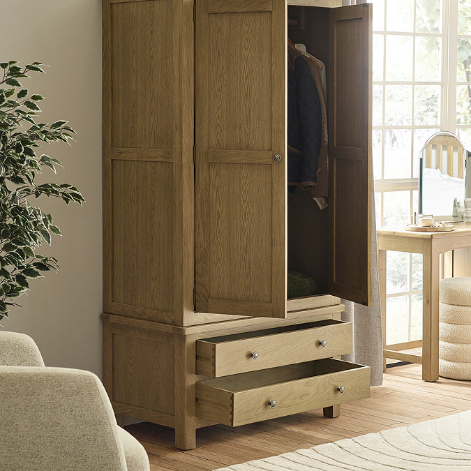 image of classic oak wardrobe with 2 doors and 2 drawers open to show space within