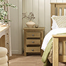 image of solid oak bedside table with three drawers open to suggest space within