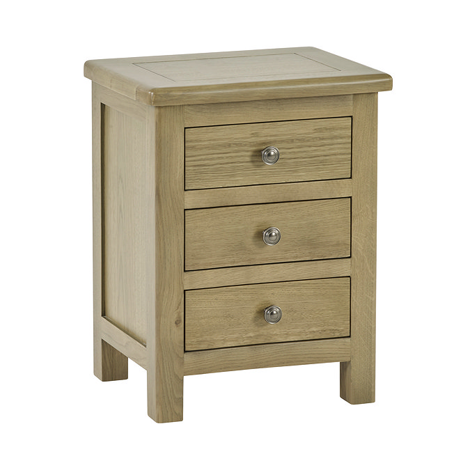image cut out on white background of solid wood three drawer bedside table