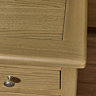 close up on smooth oak effect top of wooden bedside table