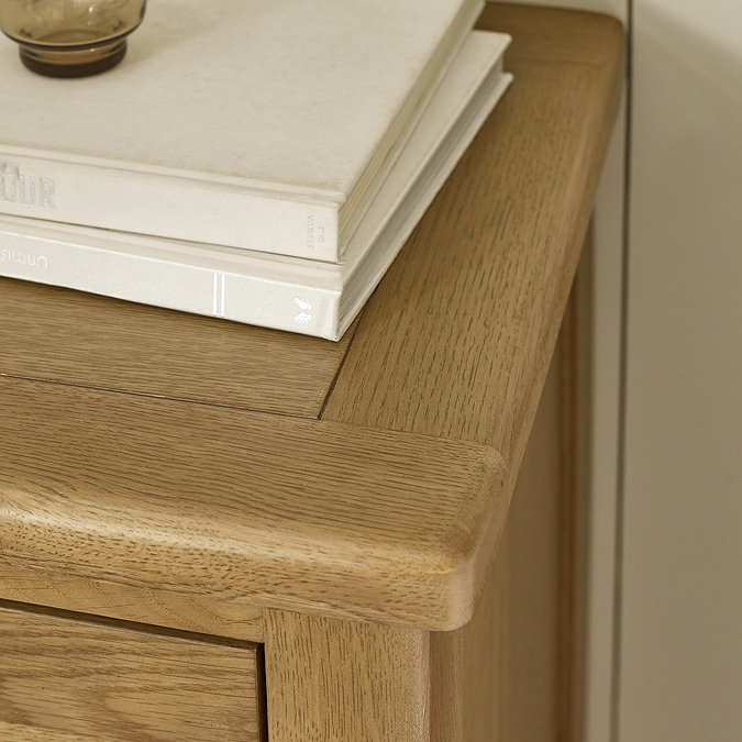 close up on smooth top of solid oak chest of drawers
