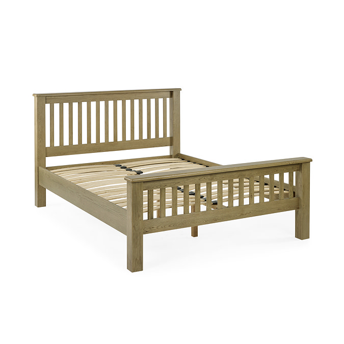 image cut out on white background of solid oak slatted bed without mattress