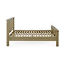 side on image cut out on white background of solid oak slatted bed without mattress