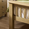 close up image of solid oak slatted footboard of bed
