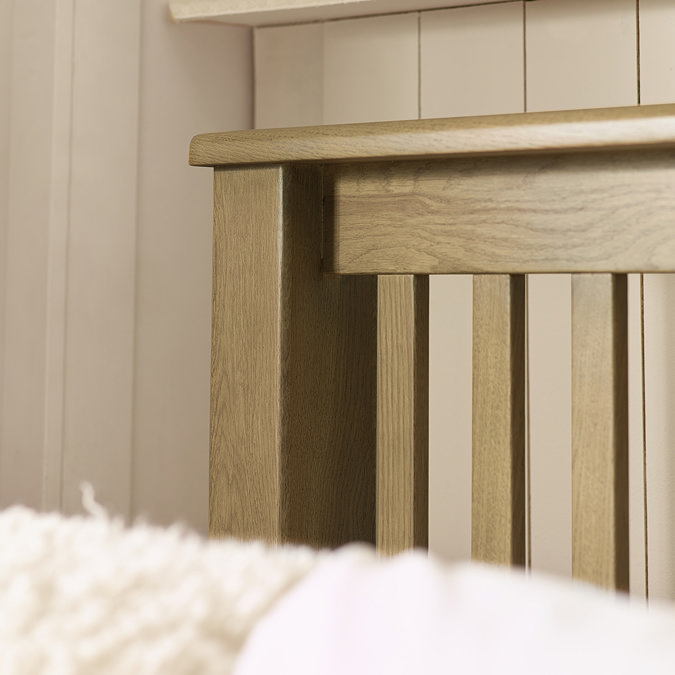 super close up image of solid oak slatted headboard of bed