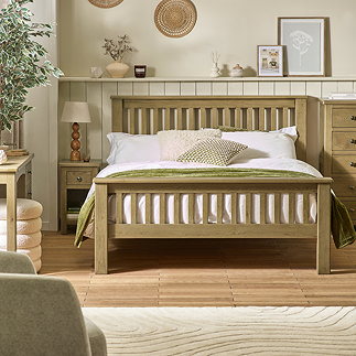 image of slatted solid oak bed in modern country bedroom