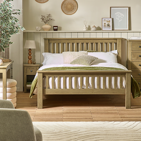 image of slatted solid oak bed in modern country bedroom