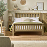 image of slatted solid oak bed in modern country bedroom