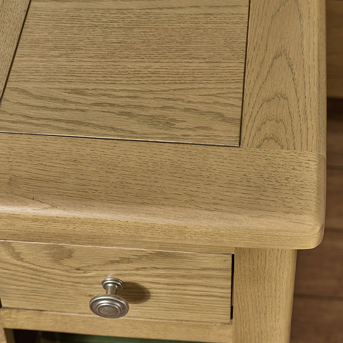close up image of smooth oak woodgrain top of bedside table