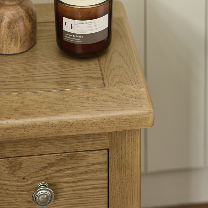 close up image of smooth edges of oak bedside table