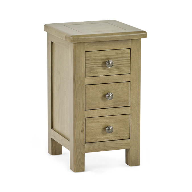 image cut out on white background of slim three drawer bedside table