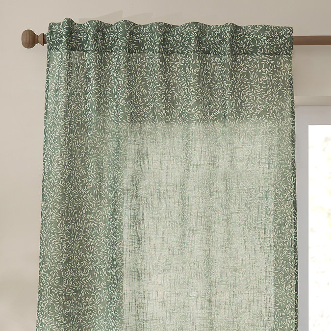 Perrie Leaf Sheer Curtain Panel in forest green on a window close up image