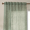 Perrie Leaf Sheer Curtain Panel in forest green on a window close up image