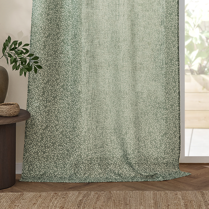 Perrie Leaf Sheer Curtain Panel in forest green on a window close up image