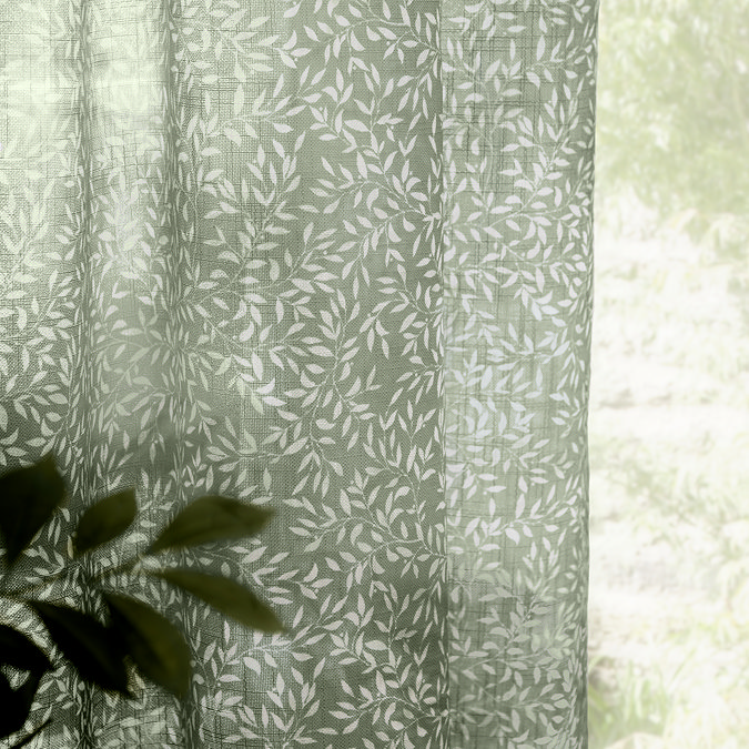 Perrie Leaf Sheer Curtain Panel in forest green on a window close up image
