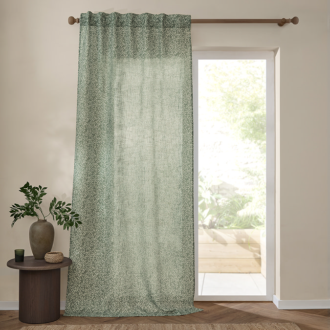 Perrie Leaf Sheer Curtain Panel in forest green on a window image