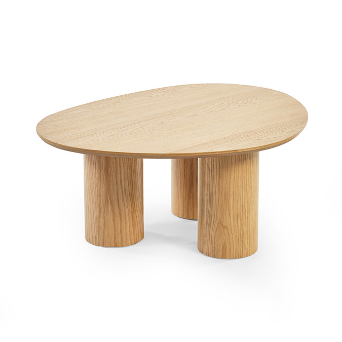 image cut out on white background of oval light oak coffee table with three pillar legs