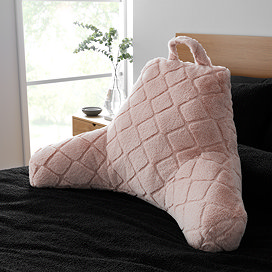 Cosy Diamond cuddle chair cushion in blush on bed image 1