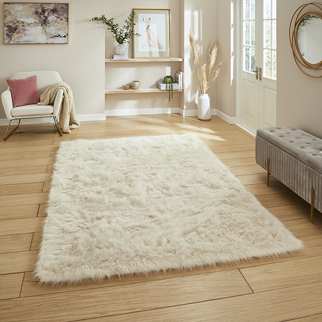 Polar plush rug in beige on floor image 1