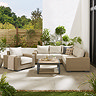 image of chunky rattan garden lounge set with deep cream cushions, on stone patio